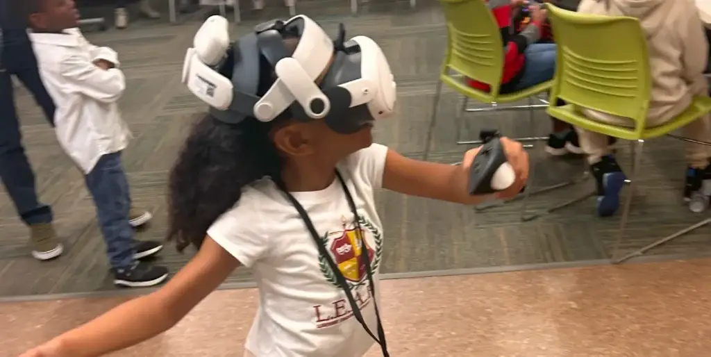 Participant using virtual reality headset during an All Out Gaming Experience event in Atlanta.